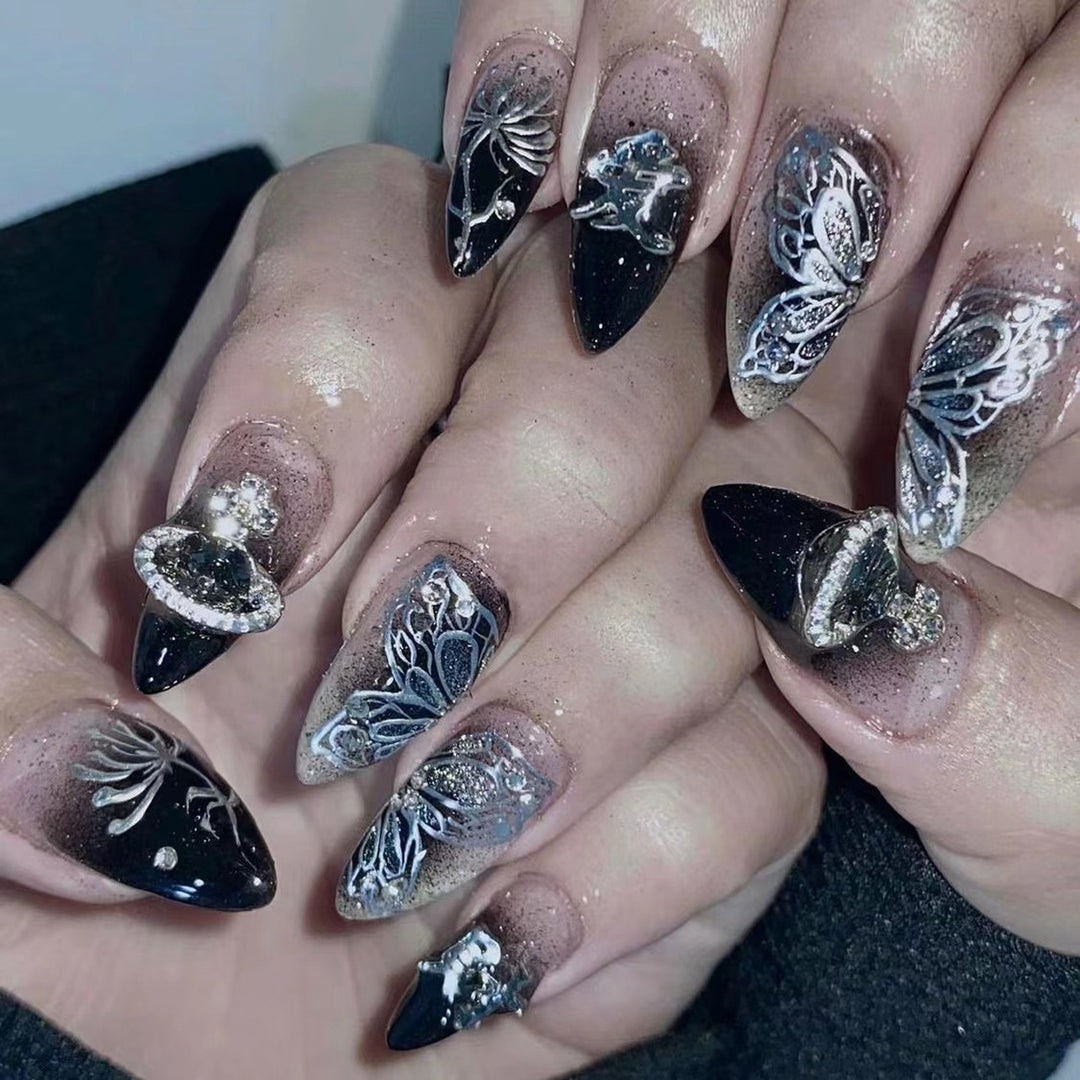 Artful stiletto nails with delicate embellishments and glamour accents Stornfield