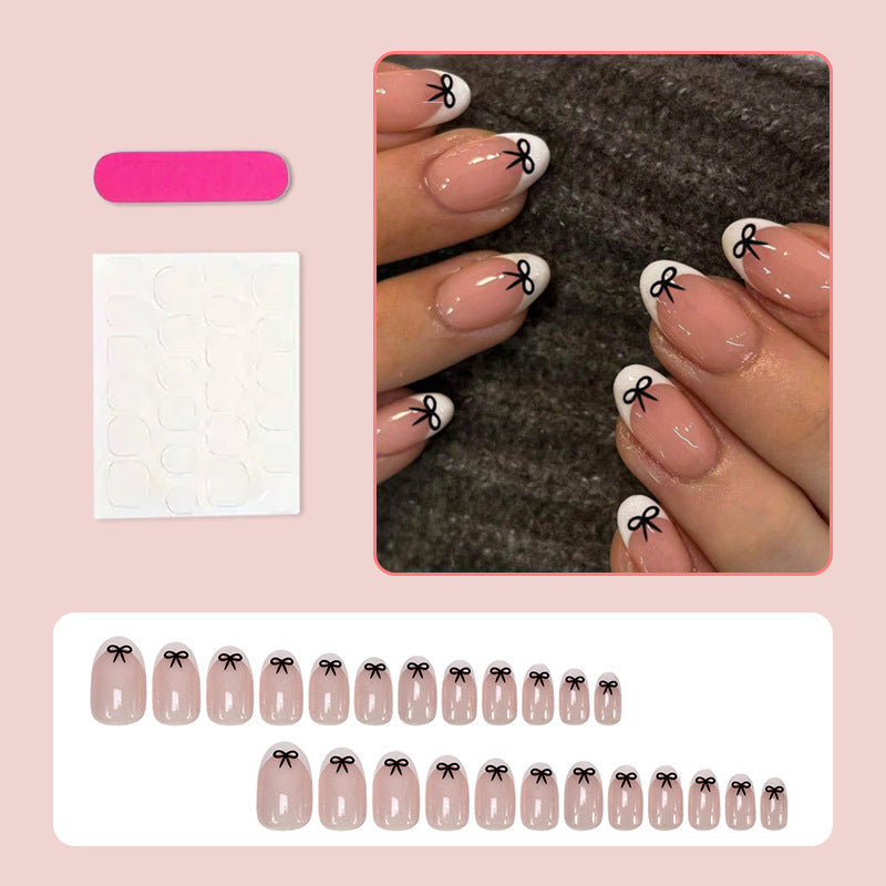Acrylic nail set with playful bow design Stornfield