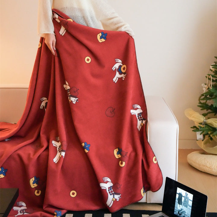 Children's cuddly blanket made of soft fleece with horse print and decorative edge