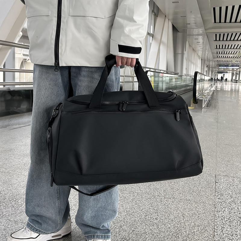 Sporty travel bag with reinforced carrying handles and multiple compartments Stornfield