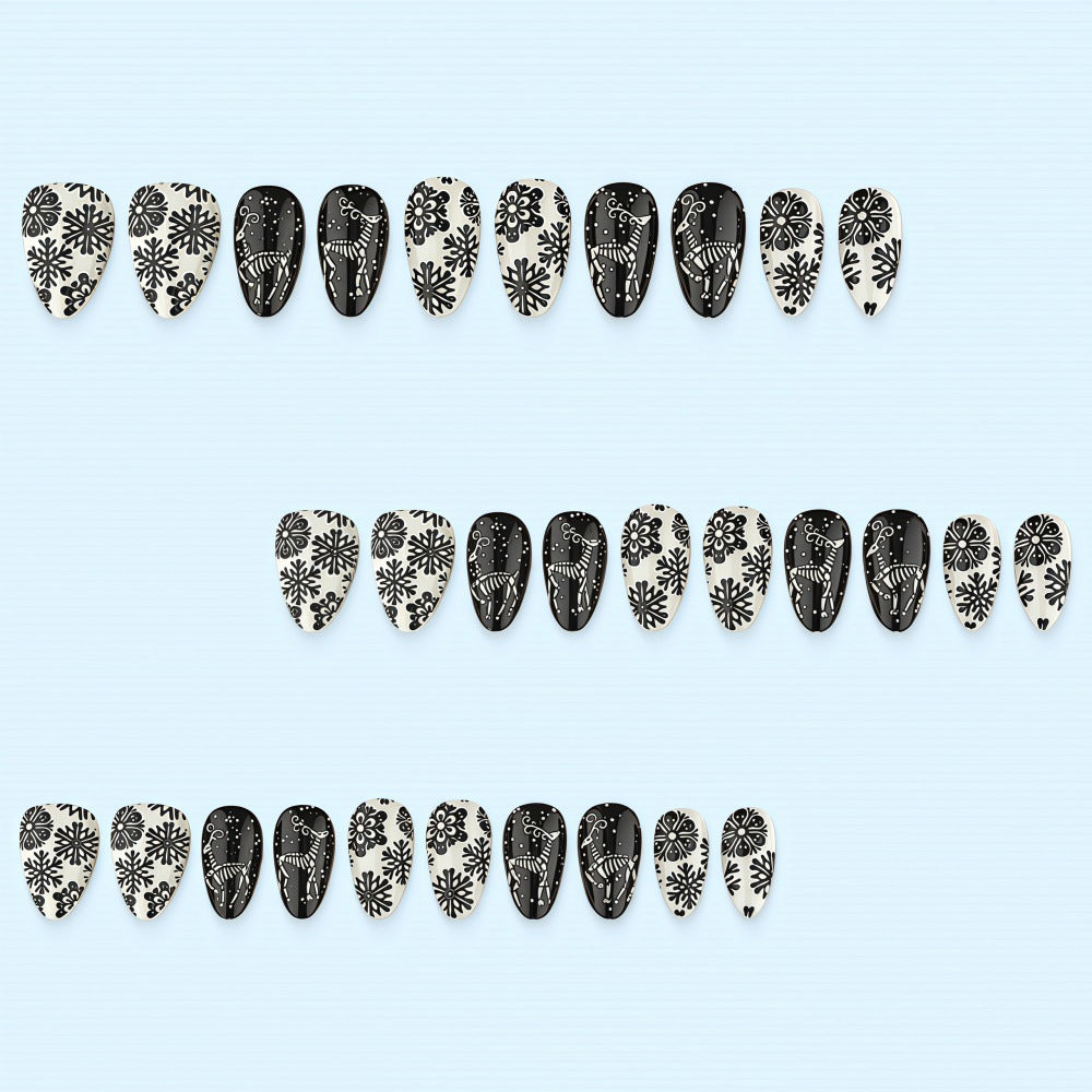 Artificial nails in a unique winter design with snow and reindeer motifs Stornfield
