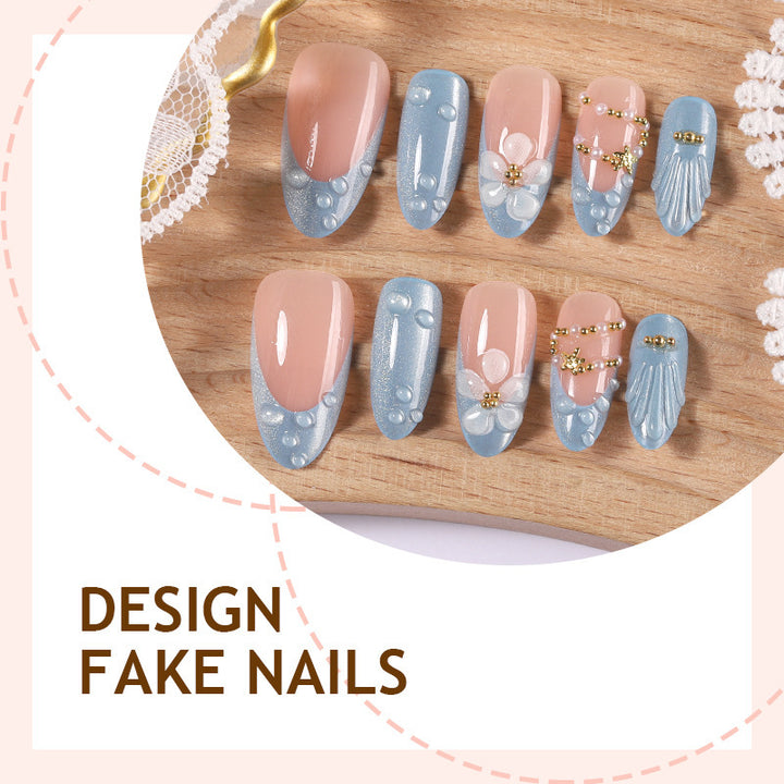 Creative acrylic nail set with elegant flower and glitter accents Stornfield