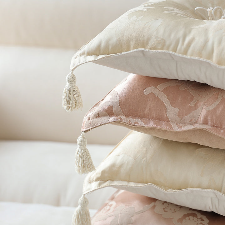 Padded floor cushion with quilted tufting and tassels
