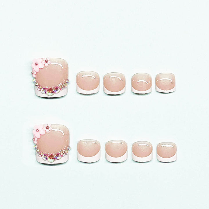 Elegant toenail art with delicate 3D floral decorations Stornfield