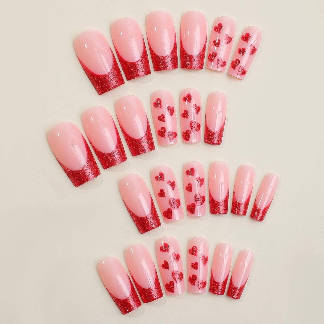 Acrylic nail set with glamorous heart designs and glitter accents Stornfield