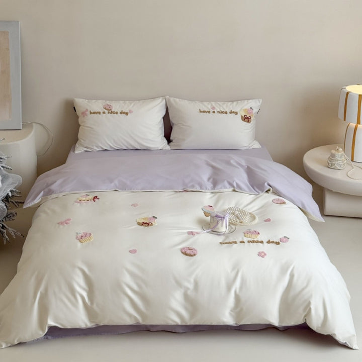 Quilted bedding set with cupcake embroideries and text application