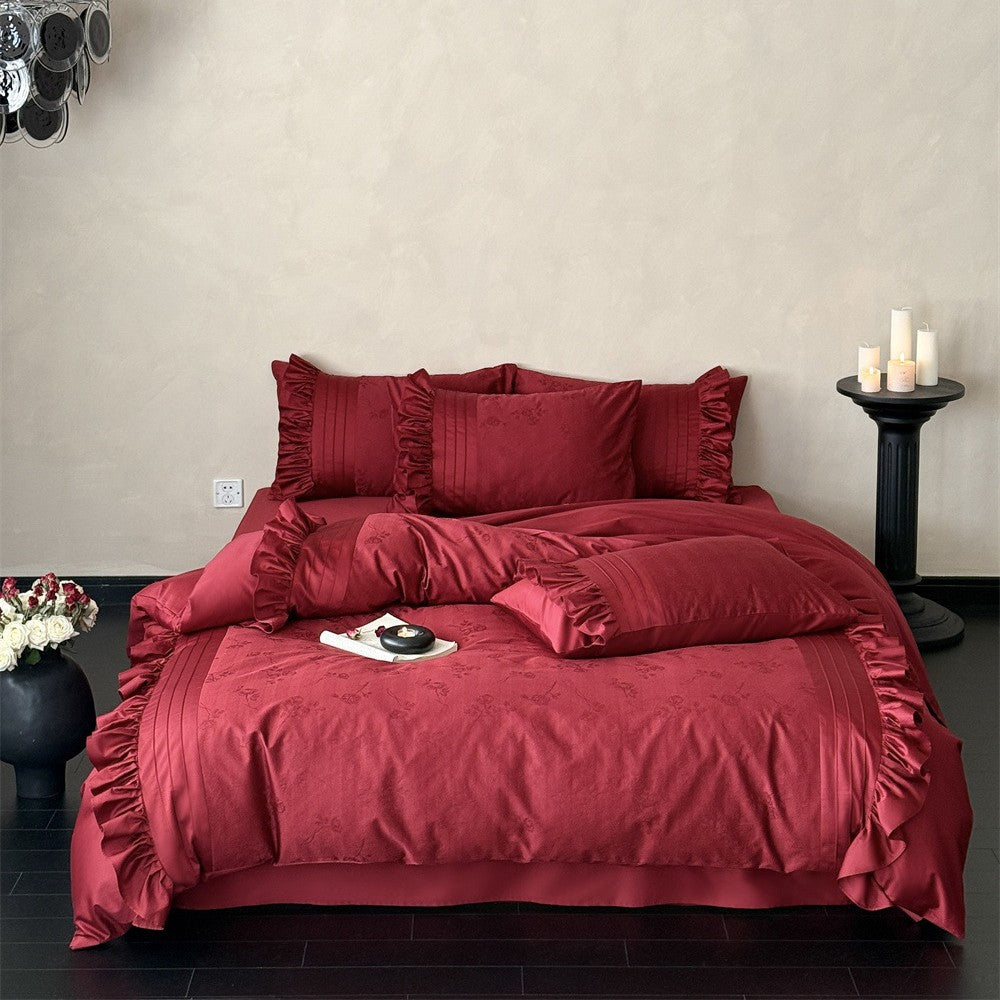 Luxurious satin bedding set with ruffles and delicate floral embroidery