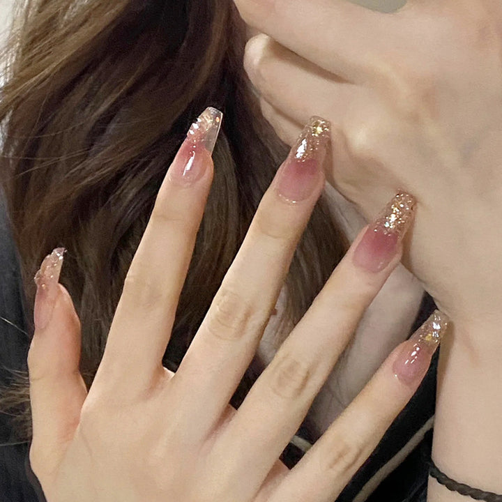 Artificial nails with glamorous glitter accents Stornfield