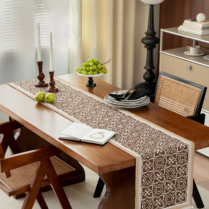 Decorative table runner with woven ornament jacquard and finely hemmed edges Stornfield