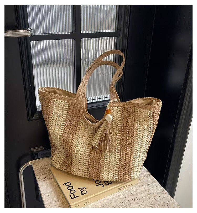 Handcrafted straw bag with elegant tassels and detailed texture Stornfield