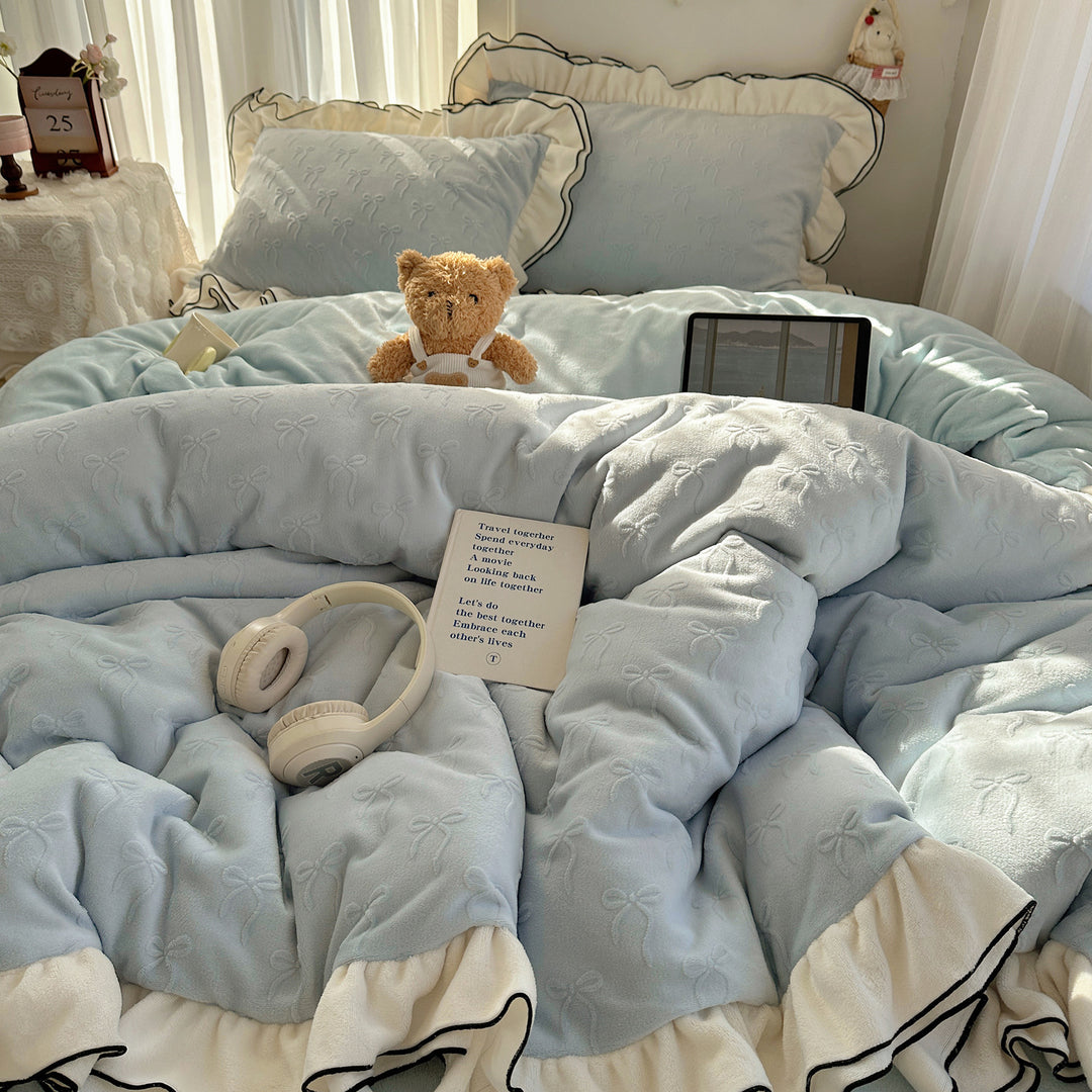 Cozy quilted bedding set with relief ribbon embroidery and contrasting ruffle edge