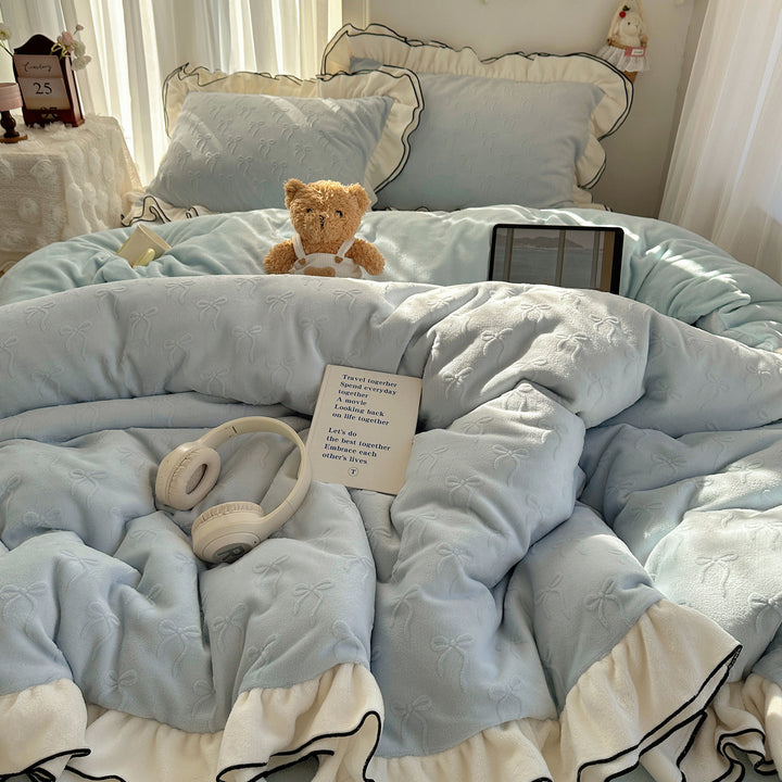 Cozy quilted bedding set with relief ribbon embroidery and contrasting ruffle edge
