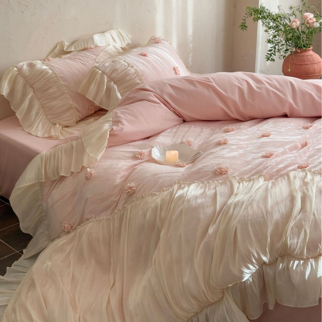 Satin look quilted bedspread with pleated ruffle and 3D flower appliqué