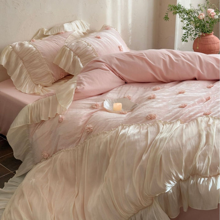 Satin look quilted bedspread with pleated ruffle and 3D flower appliqué