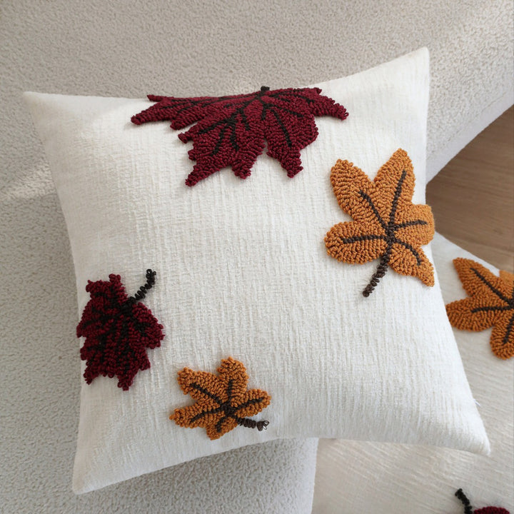 Square cushion cover with hand-tufted autumn leaf appliqués Stornfield