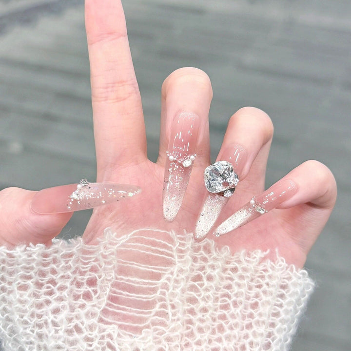 Artificial nails with glitter and crystal embellishments Stornfield