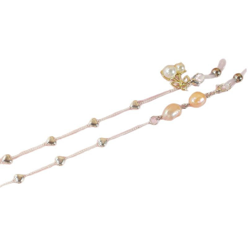 Elegant jewelry ribbon with pearls and silver accents Stornfield