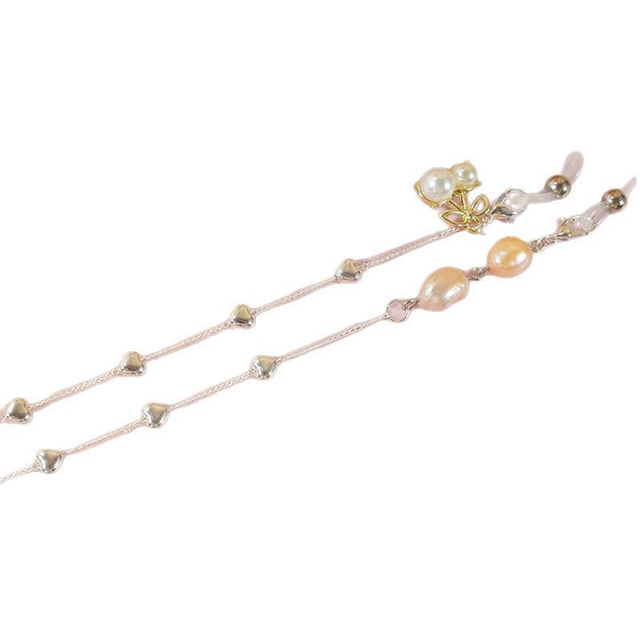 Elegant jewelry ribbon with pearls and silver accents Stornfield