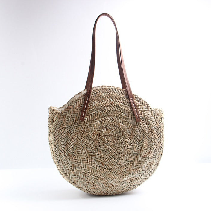 Braided straw beach bag with elegant leather handles Stornfield