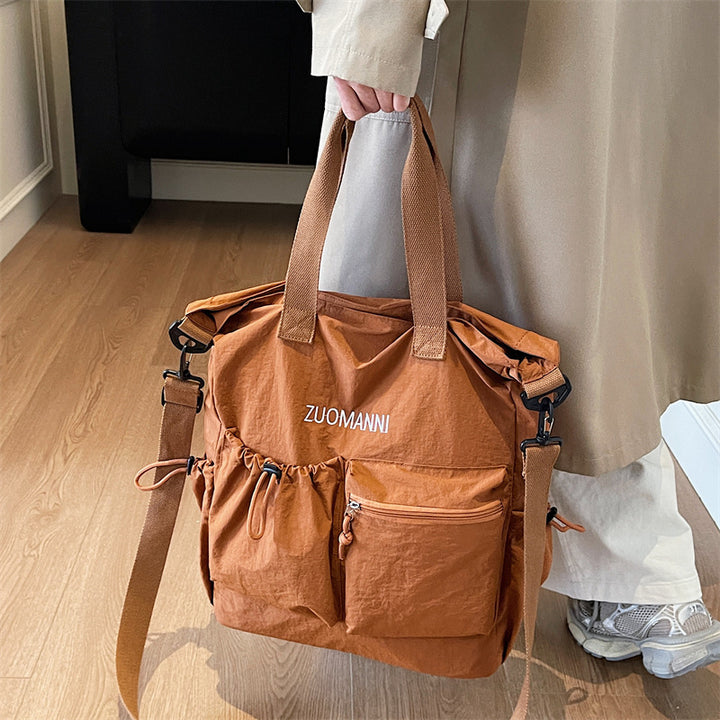 Tote bag with multifunctional outer pockets and adjustable shoulder strap Stornfield