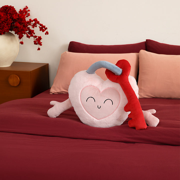 Plush heart cuddle pillow with sewn-on key motif and cute embroidered face Stornfield