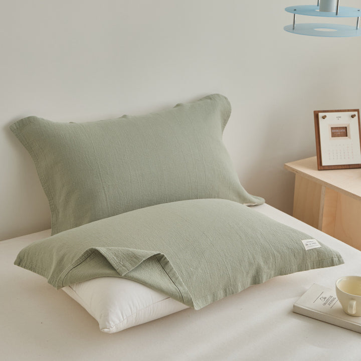 Textured cushion cover set made of cotton-linen blend with waffle structure