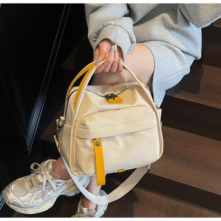 Fashionable shoulder bag with innovative structure and detachable carrying strap Stornfield