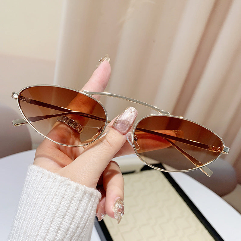 Ladies fashionable sunglasses in elegant oval design Stornfield