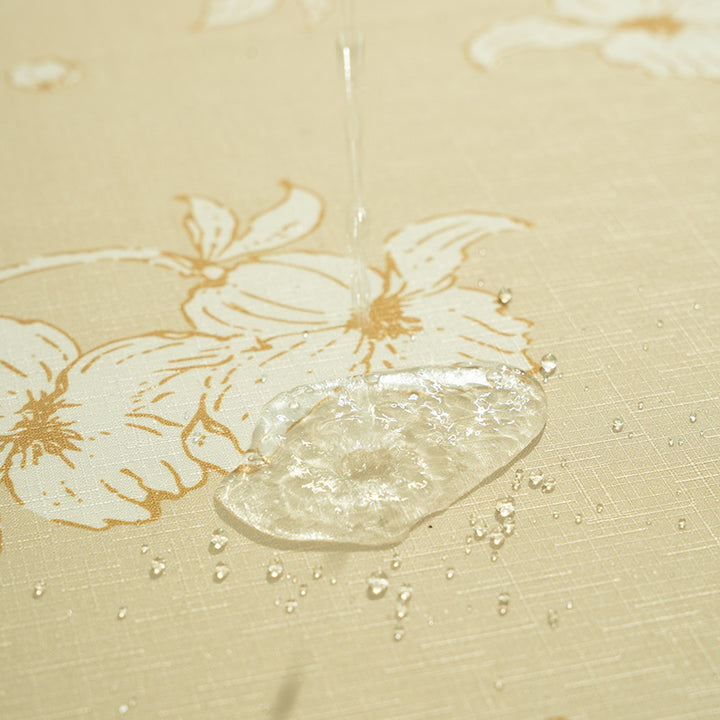 Round wipeable tablecloth with floral cut-out hem Stornfield