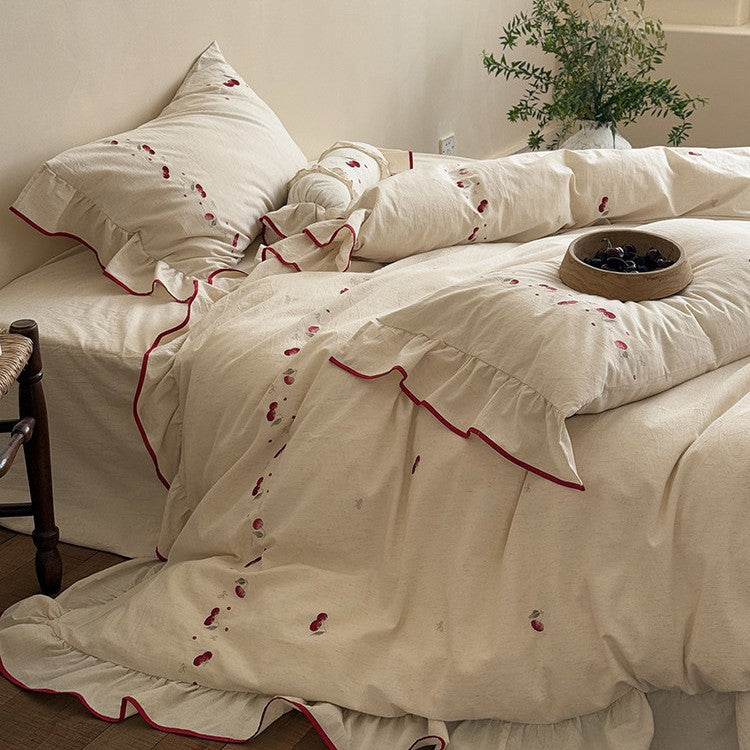 Bedding set with delicate cherry embroidery, ruffle and linen look