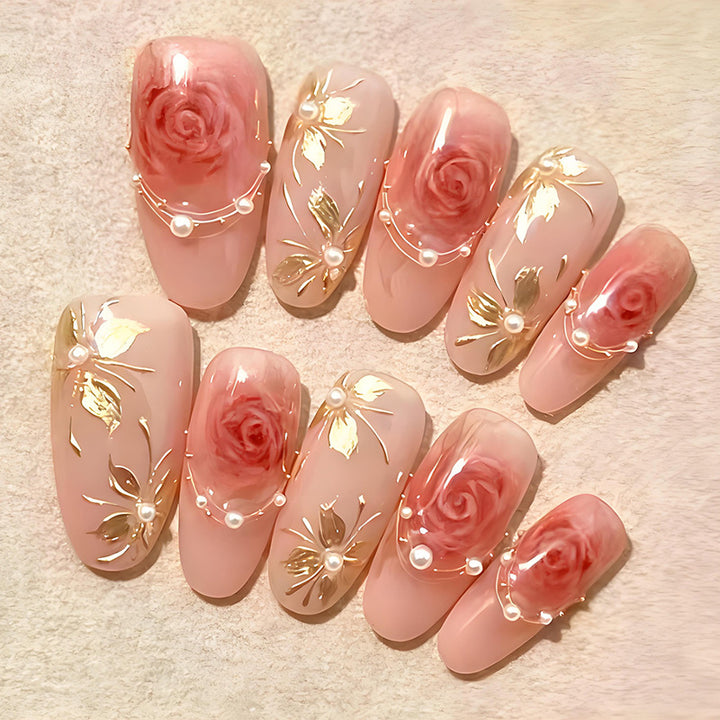 Artificial nail set with romantic rose designs and golden embellishments Stornfield
