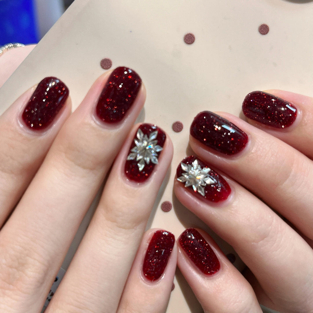 Glamorous artificial nails with rhinestone applications Stornfield