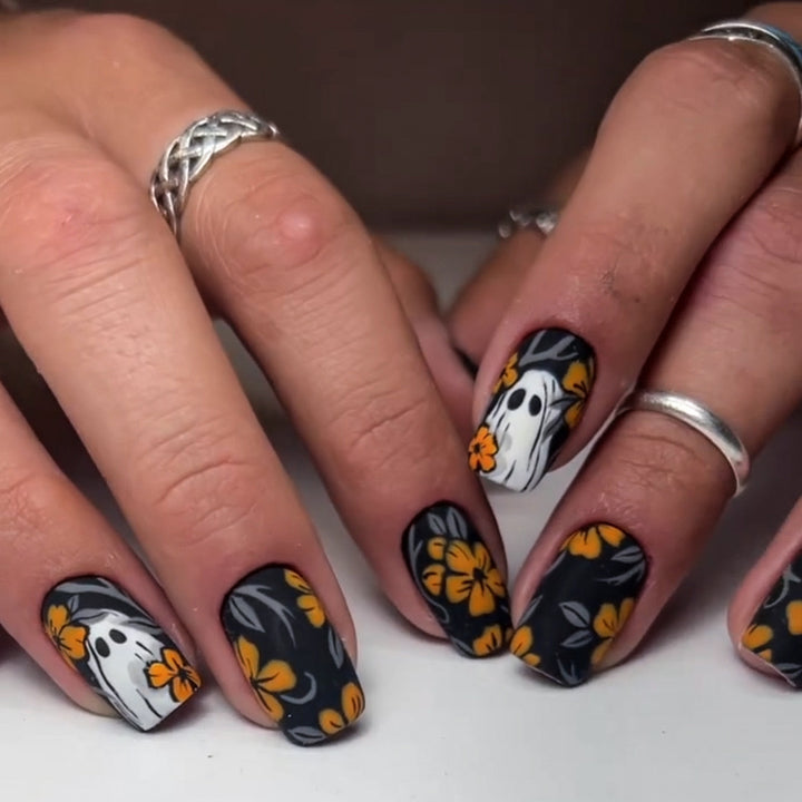 Acrylic nail set with spooky ghost design and floral accents Stornfield