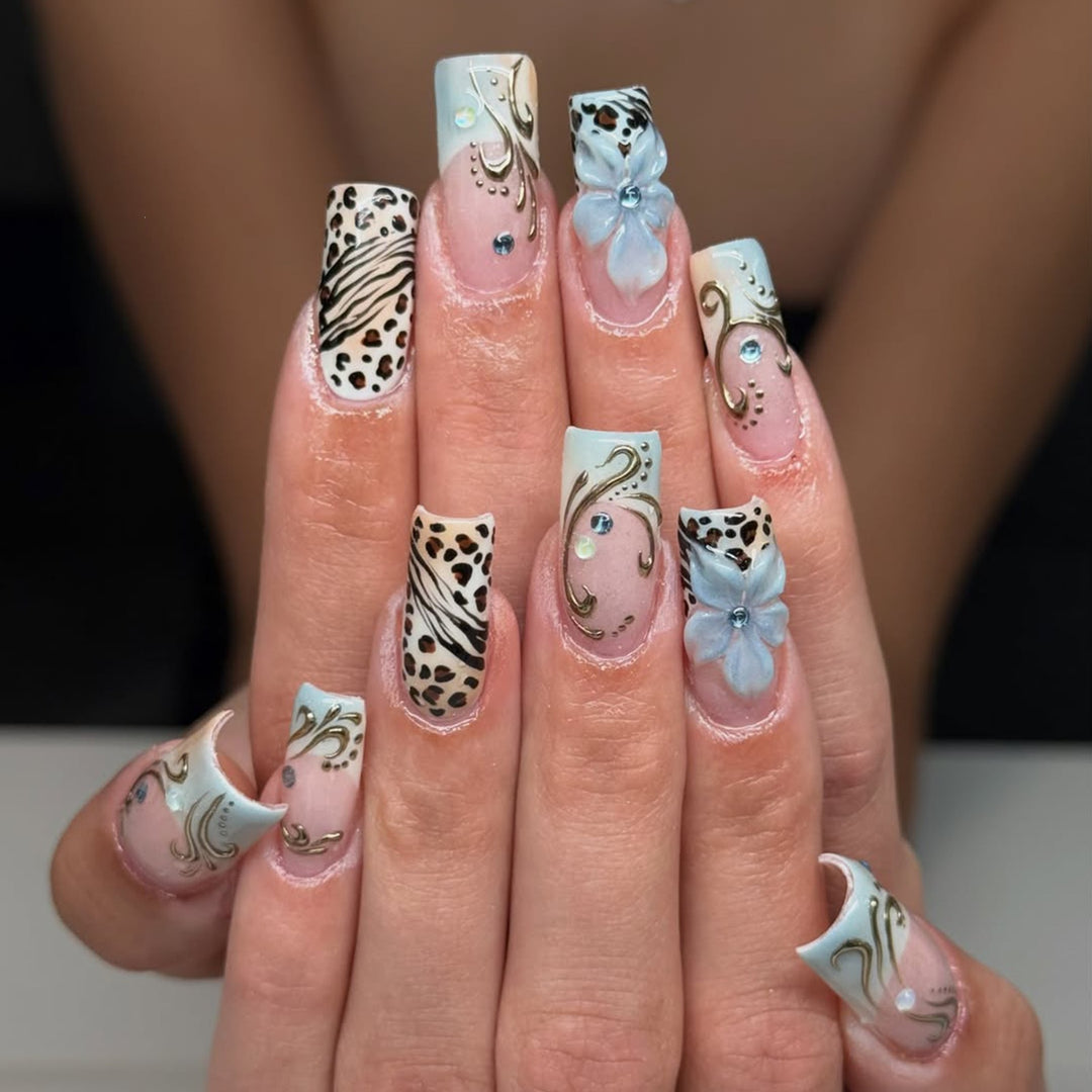 Glamorous artificial nail set with floral accents and glitter details Stornfield
