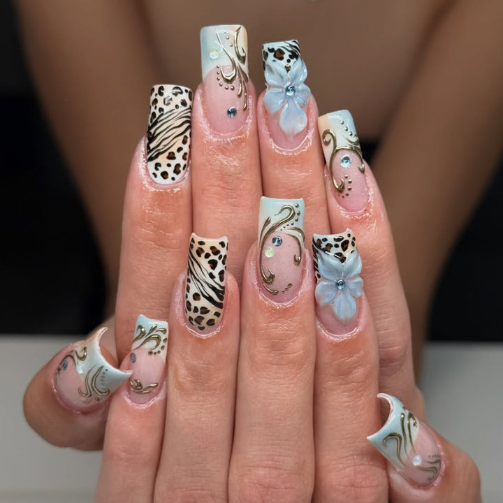 Glamorous artificial nail set with floral accents and glitter details Stornfield