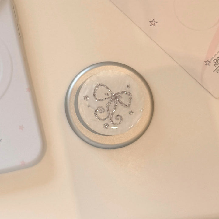 Stylish smartphone finger holder with glitter bow design Stornfield