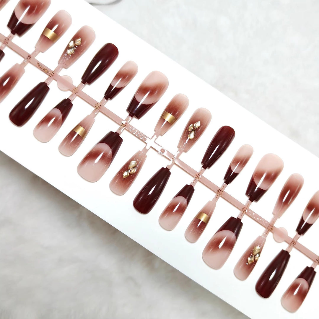 Artificial nails with elegant color gradients and jewelry details Stornfield