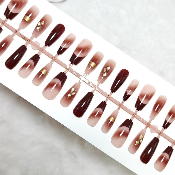 Artificial nails with elegant color gradients and jewelry details Stornfield