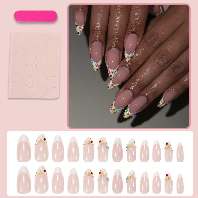Acrylic nail set with glamorous embellishments and elegant accents Stornfield