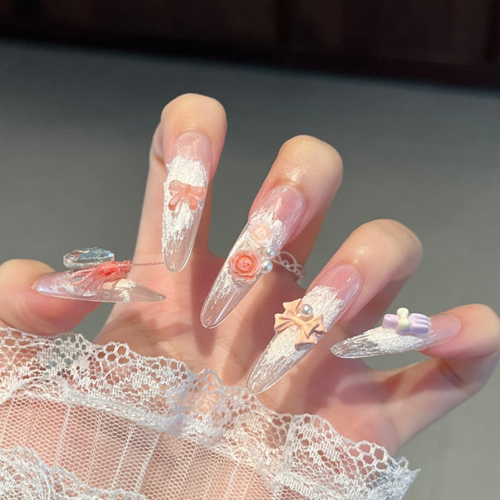 Artistic Stiletto Press-On Nail Art with Glimmering Accents Stornfield