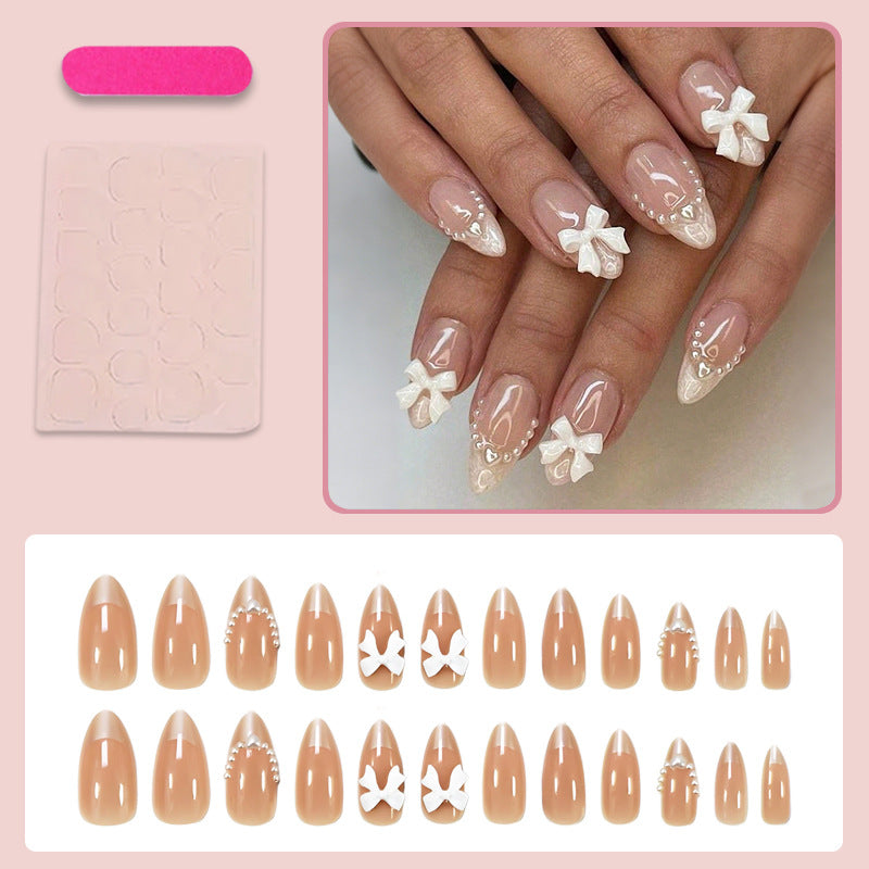 Artificial nail set with elegant bows and glitter details Stornfield