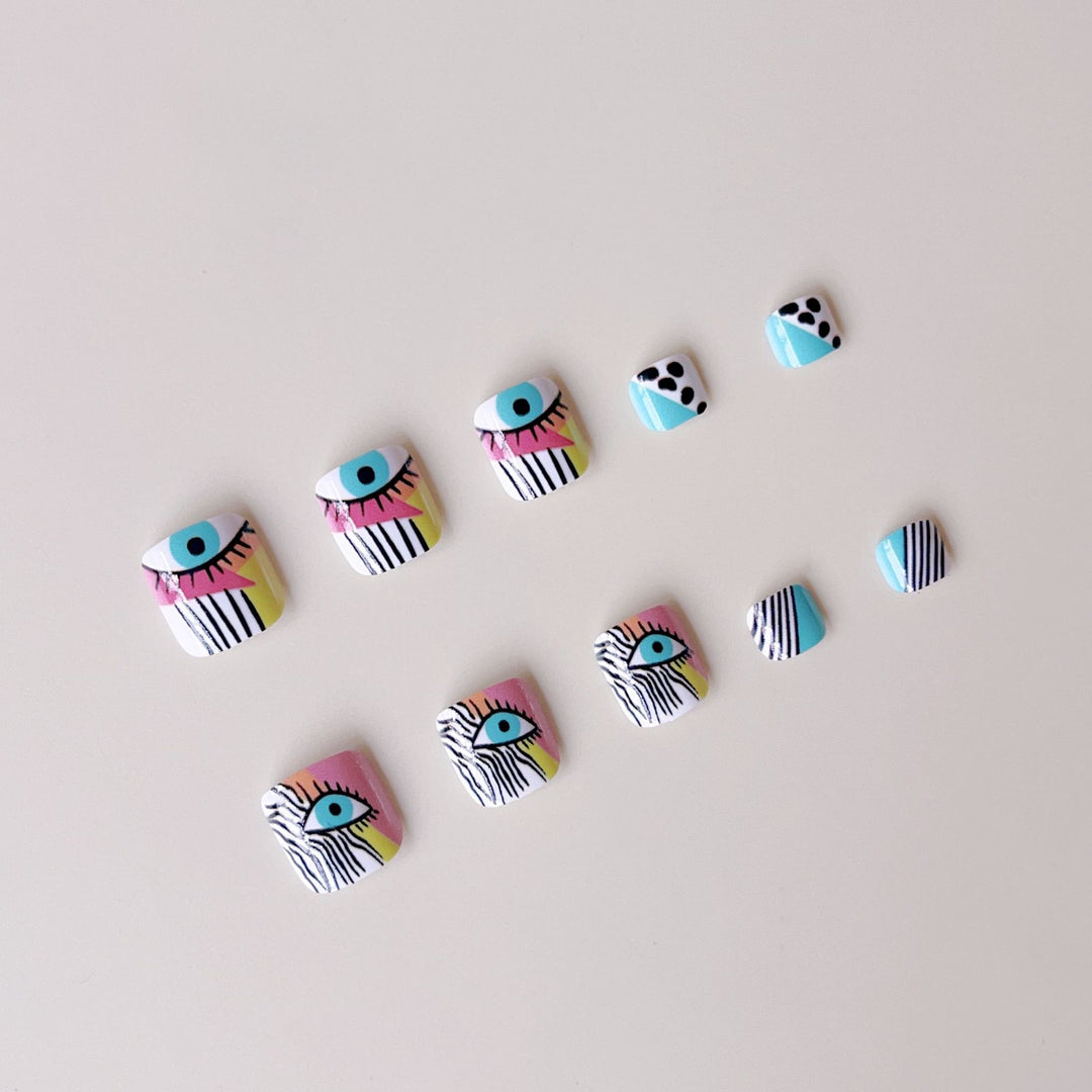 Artificial nail set with vibrant color accents and geometric patterns Stornfield