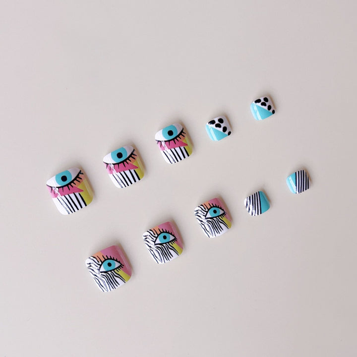Artificial nail set with vibrant color accents and geometric patterns Stornfield