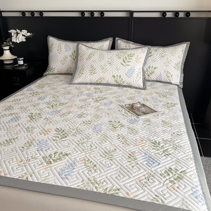 Quilted bedspread and pillow set with geometric striped quilting