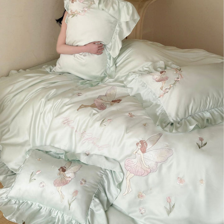 Satin bedding set with embroidery and ruffled hem