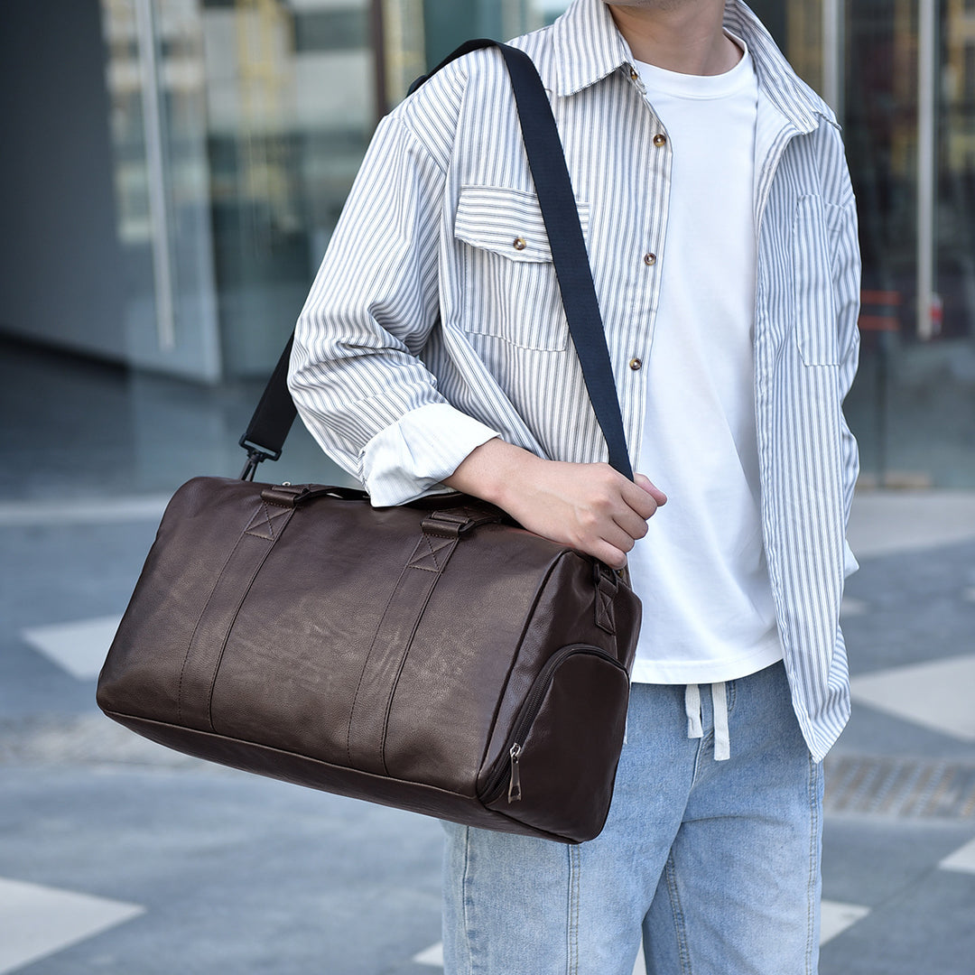 Travel bag made of high-quality leather with robust carrying handles Stornfield