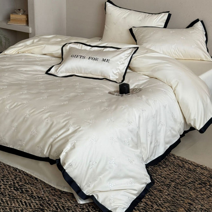 Noble cotton satin bedding set with tone-on-tone floral embroidery and contrasting piping