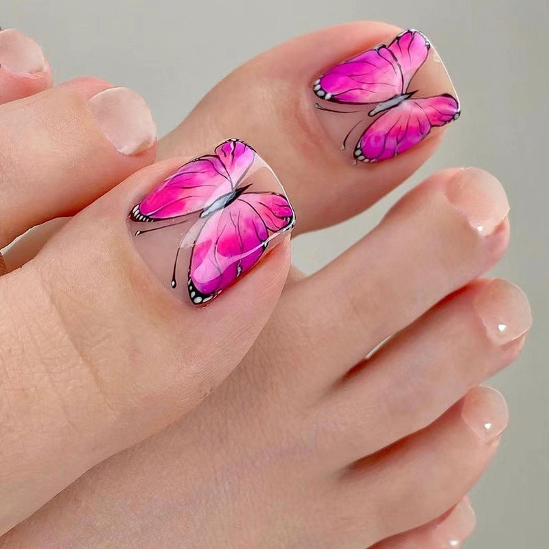 Artful toenail design with butterfly design Stornfield
