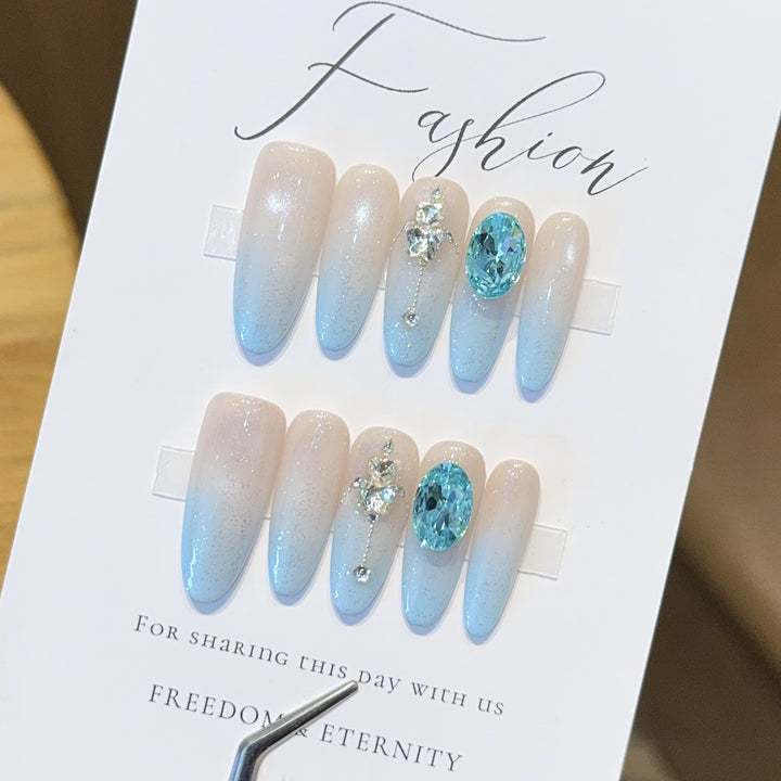 Glamorous artificial nails with sparkling rhinestone details Stornfield