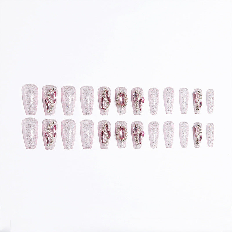 Glamorous artificial nails with sparkling rhinestone decorations Stornfield